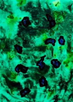 green abstract painting with black spots